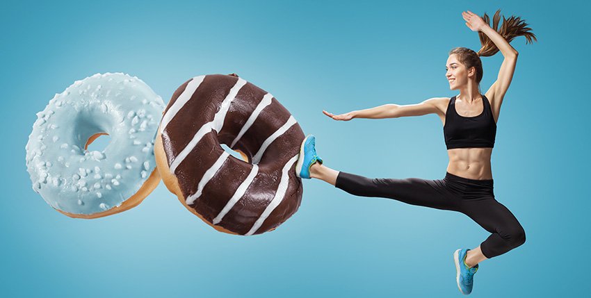 photo of a woman jump kicking junk food